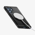 ACS08964 ACS09008- Galaxy S25 Ultra Case Tough Armor AI (MagFit) in Black showing the back, partial side and bottom with magsafe charger attached